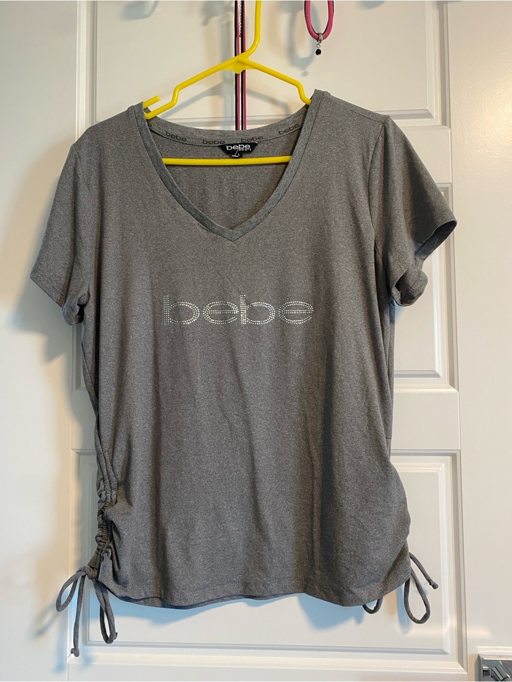 NWOT BEBE Gray V-Neck Short Sleeve Rhinestone Logo Tee with Side Ties